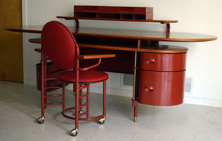 Originally designed in 1936 for the S.C. Johnson Wax Company's Administrative Building in Racine, Wisconsin by Frank Lloyd Wright, this rare iconic desk (Cassina 617) and chair (Cassina 618) are truly functional pieces of art!  Brick-red tubular
