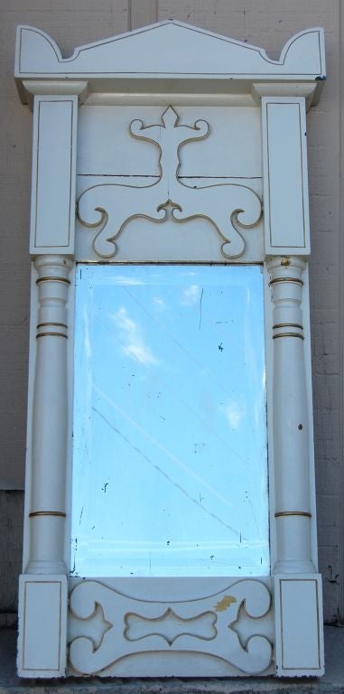 Antique painted mirror with gilded accents and beveled mercury mirror. 

The painted finish has been distressed over time, but we will be happy to touch up these areas with matching painted upon request.