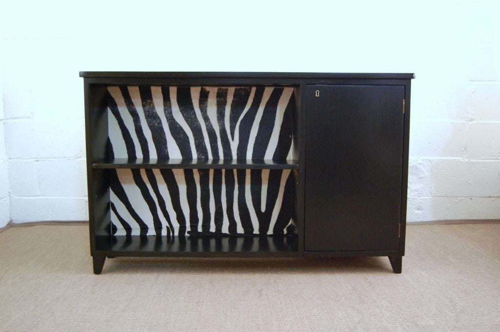 Fabulous black lacquered writing desk with bookcase and lockable cabinet on front and curved desktop, pencil drawer and another cabinet with dovetailed drawers on the desk side.  Zebra printed cowhide leather insert behind drawers.  Very striking