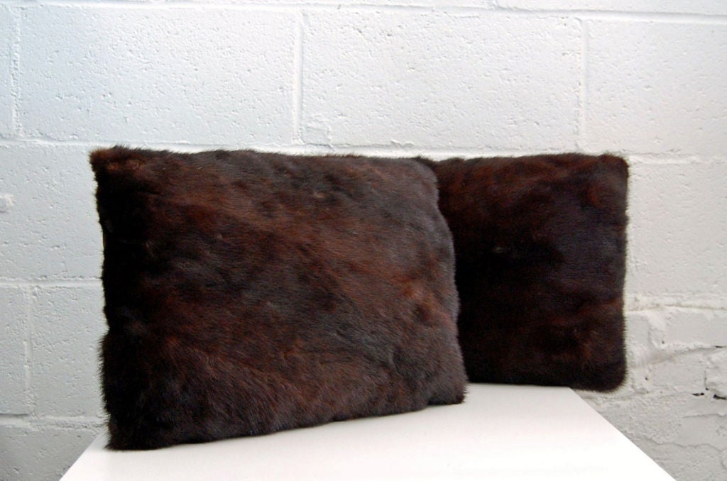 Description: Indulge in the sumptuous feel of fur with these impeccably detailed mink fur pillow. Made from genuine lush mink fur reclaimed from clean vintage coat c. 1950's. Variegated shades of rich chocolate and dark caramel mink fur on the front