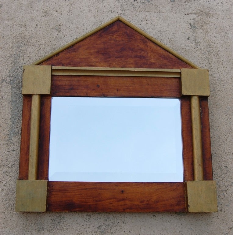 Antique wood frame with gilded accents and beveled mercury mirror.
