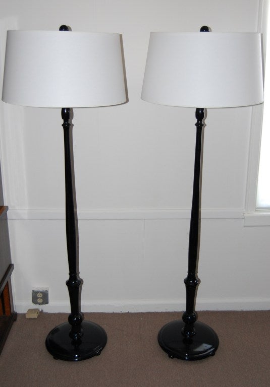 Pair of Art Deco shiny black lacquer lamps with custom ivory paper shade.

Measures: Overall dimensions 68 1/2