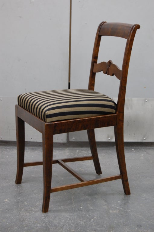 4 side chairs and 2 arm chairs.
Antique Swedish Karl Johan Revival 
c. 1915 Sweden
Dark flame birch
Black and gold woven stripe fabric
Newly upholstered


Dimensions
Arm Chairs: 22 3/4