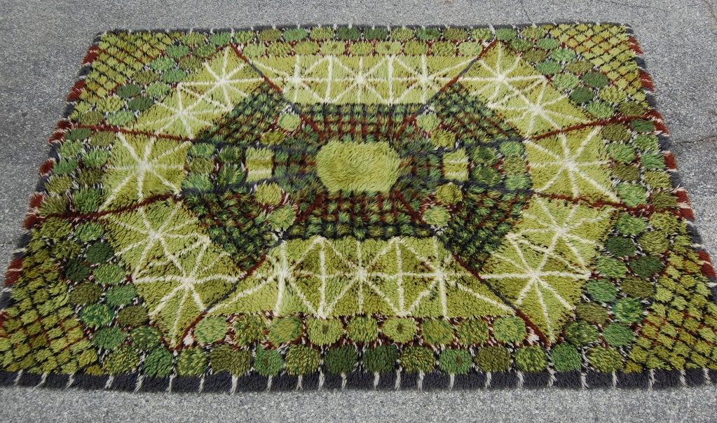Vintage 1960's Swedish Modern hand-knotted rya rug in gorgeous shades of green with brown spider-web design.

We also have a smaller version of this rug listed: http://www.1stdibs.com/furniture_item_detail.php?id=456045