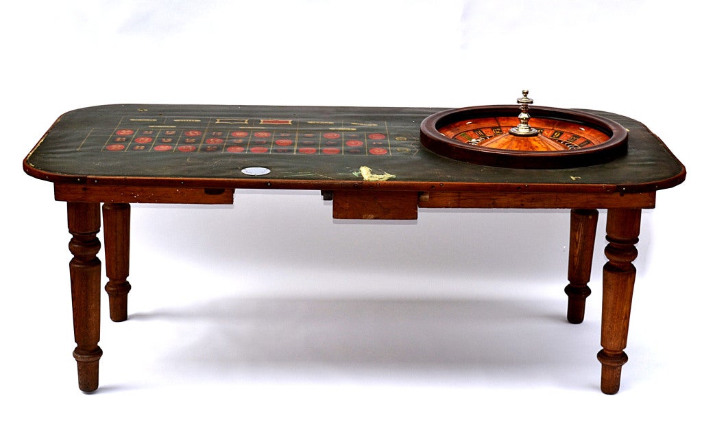 American Roulette wheel with double zeroes and custom table. Made in 1906 by the Rocky Mountain Sporting Goods Company, Denver, Colorado. Wheel was featured on the cover of Gambler's Digest in the 1980's (the issue accompanies piece).