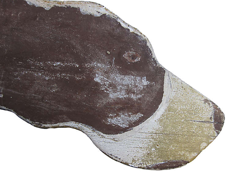 Circa 1920 rare wood double sided pointer dog weather vane, standing on a shot gun, untouched and original age cracked painted surface, with an in use old repair to tail.