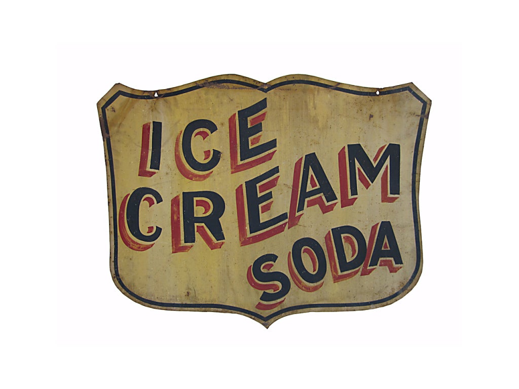 Circa 1930 shield shaped double sided tin sign 'Ice Cream Soda' with professional black and red lettering on a mustard ground, as found surface and condition