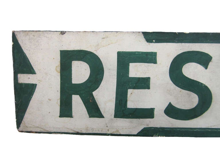 Circa 1930 wood double sided 'Rest Rooms' sign on original iron post, professional green lettering on a white ground painted with an arrow, more than likely used at a camp ground, original surface and condition