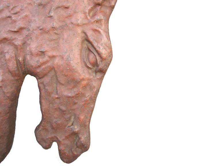Rare early 1900 double horse head cast iron boot scraper showing nice detailing, original barn red painted surface, custom wall bracket