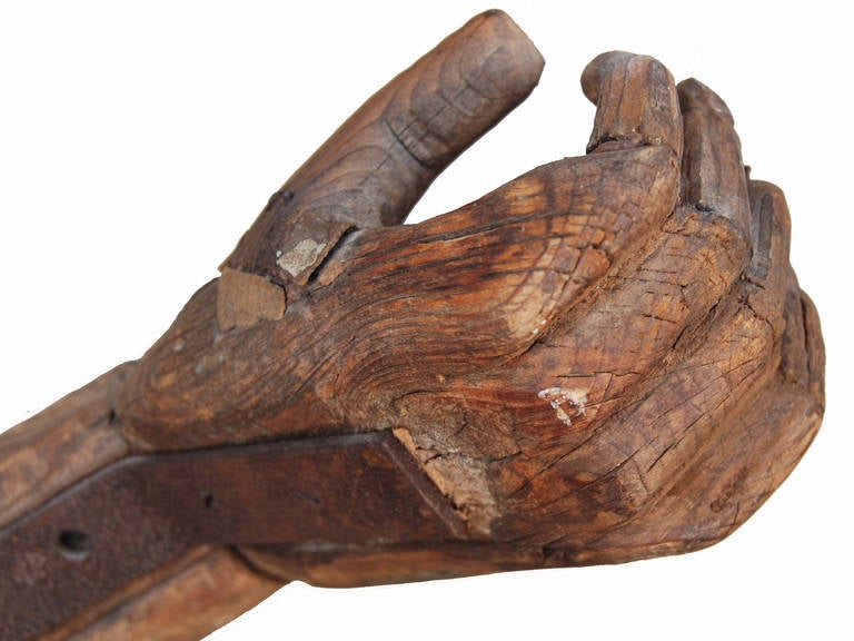 Circa 1900 sculptural wood human arm showing great detail, iron bracing accents, as found surface and condition, new table mount stand (not shown).