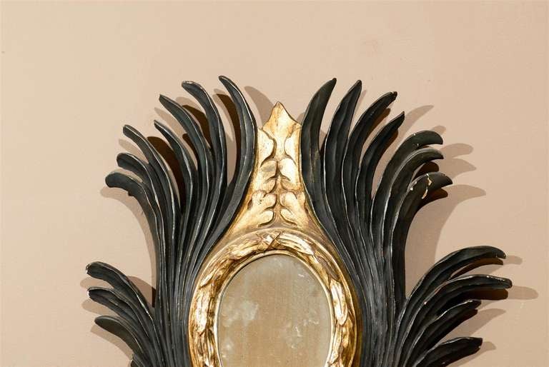 Beautiful pair of 19th Century Italian carved giltwood and ebony patina mirrors.