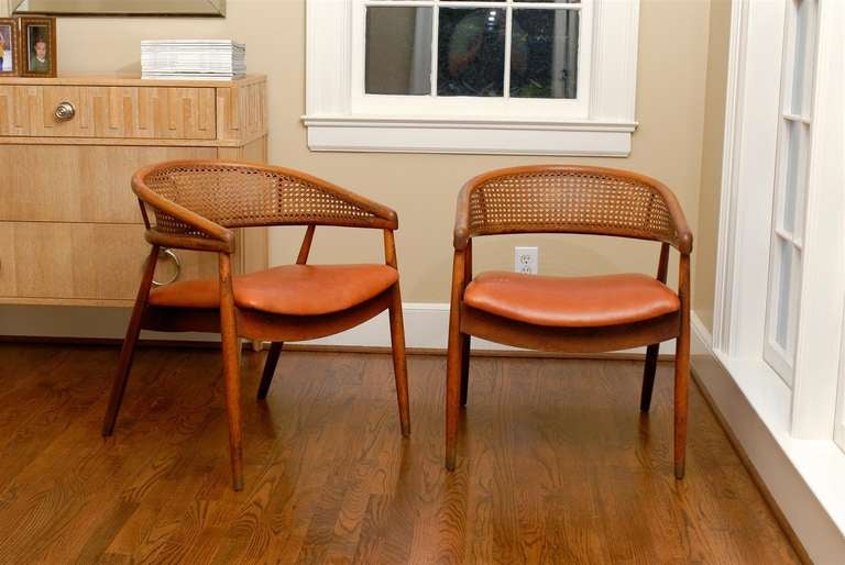 A masterfully designed pair of bent beech wood chairs with hand caned back. In the James Mont designed King Cole Penthouse in Miami, Mont used this very chair model. He specified a gilt version with an upholstered back in that particular project.