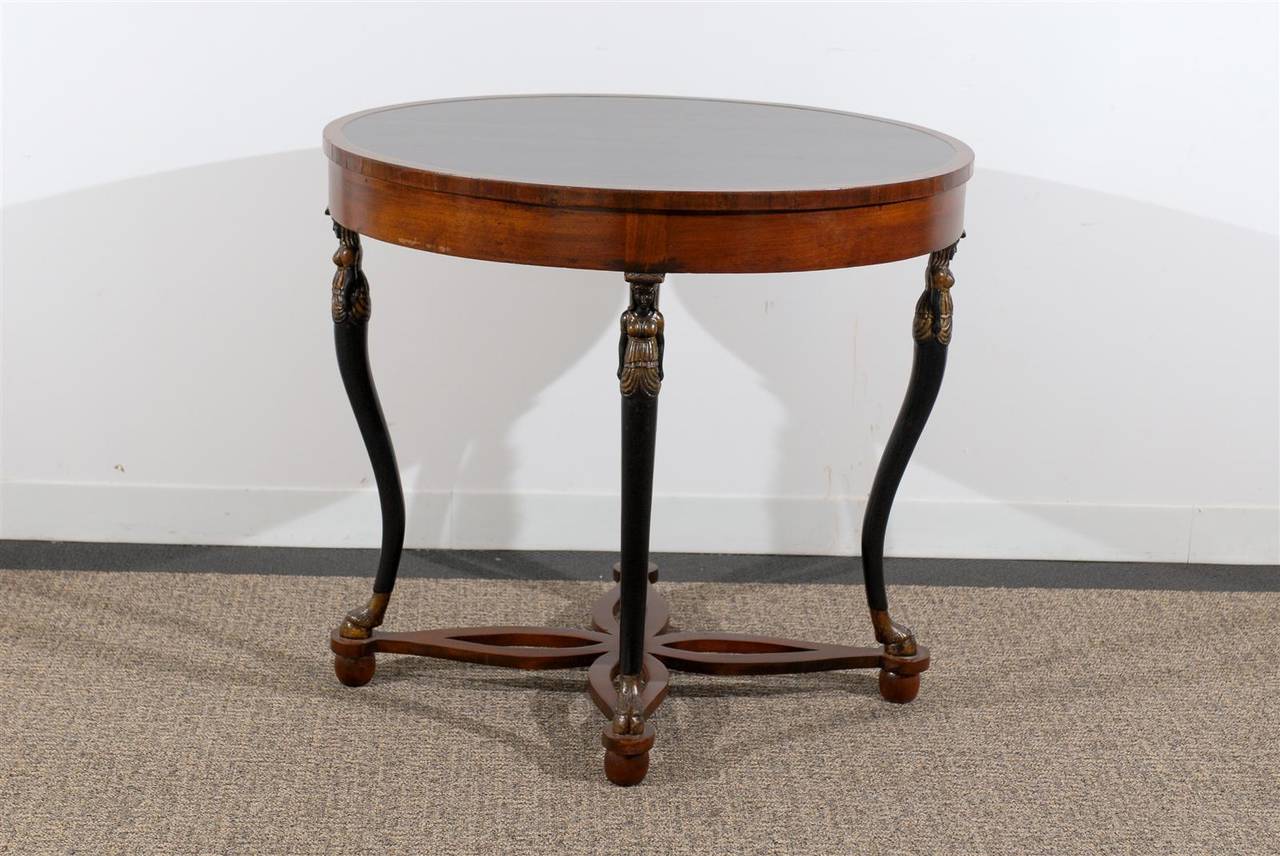 Oval Neoclassical Style Table Raised by Carved Figures In Excellent Condition For Sale In Atlanta, GA