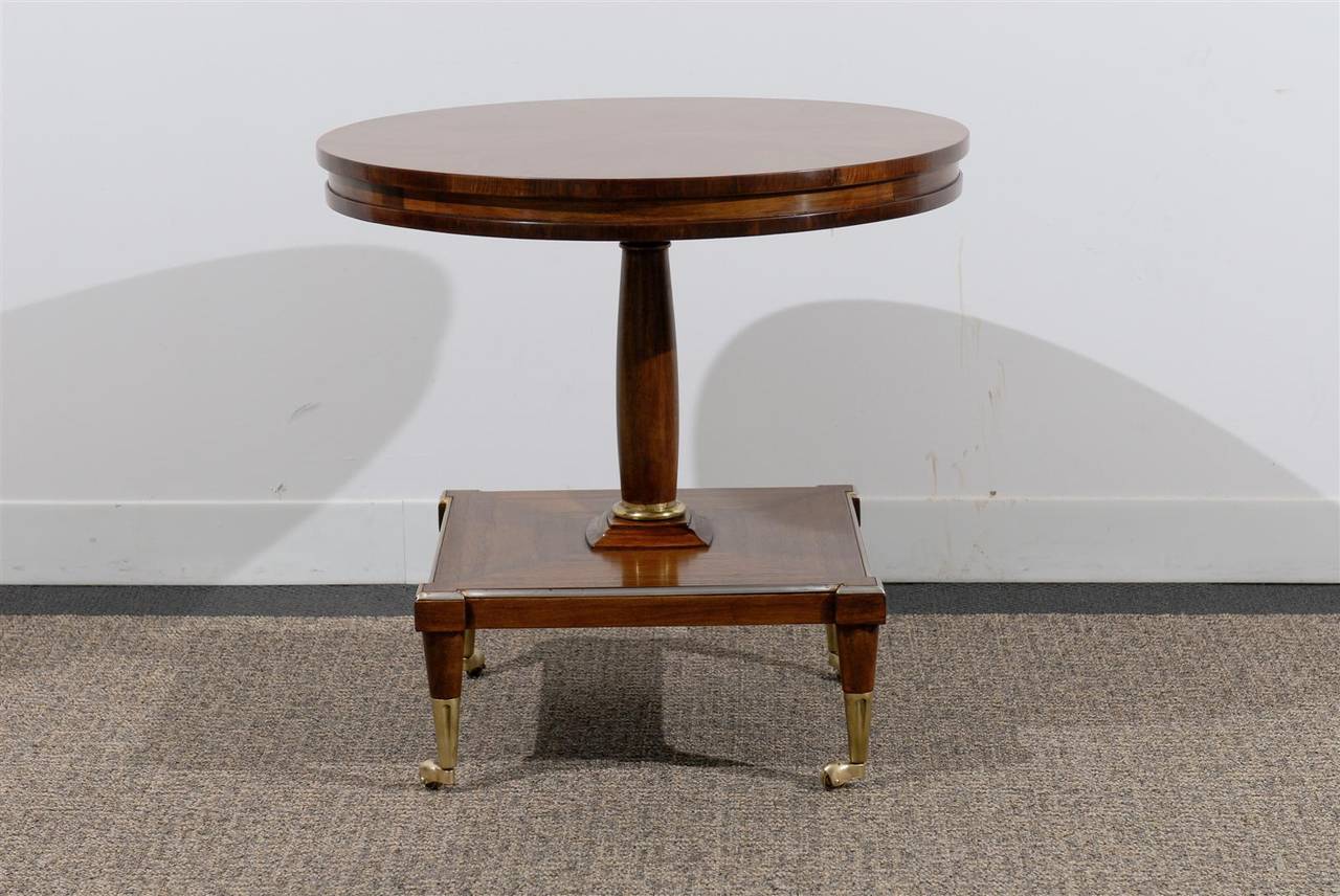 Vintage Pedestal Table with Unusual base on Brass Casters and Trim Detail  Made by Drexel Furniture Circa 1960. Restored and French Polished