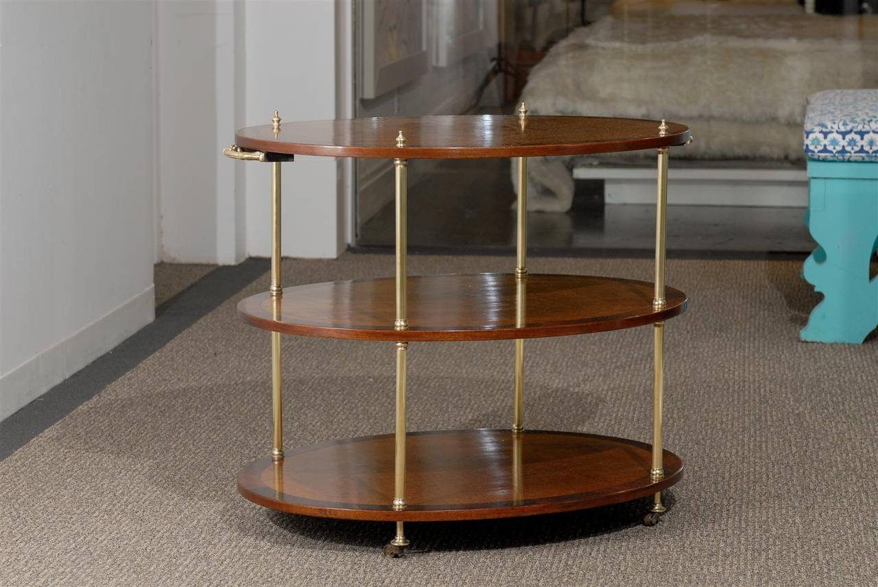 Three Tier Regency Style Etagere on Brass Casters and Contrast Banding.