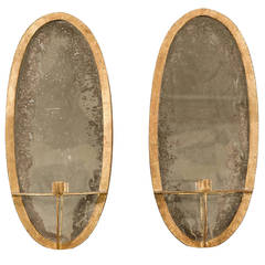 Pair of Oval Gilt Iron Sconces with Mirrored Backs