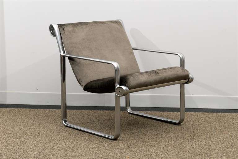 An absolutely stunning pair of the iconic lounge chair designed by Bruce Hannah and Andrew Morrison for Knoll, circa 1970s. Aluminum with polished stainless steel accents. This rare arm version (most of the production was slipper style) has been