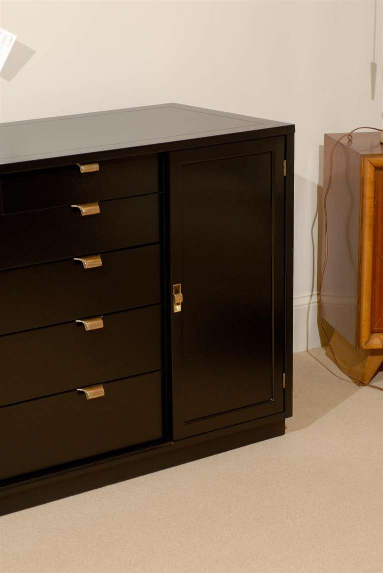 A Beautiful multi-purpose case piece by Edward Wormley for Drexel, circa 1947. Wonderful design allows for use as a chest, buffet or credenza. Restored in black lacquer to provide contrast for the sublime brass hardware. Excellent Restored