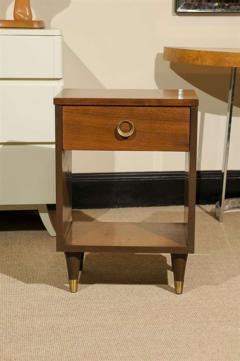 A Handsome pair of Modern end tables/night stands in Walnut, circa 1960. Beautiful, warm tone with lovey brass details. Excellent Vintage Condition. The price noted is for the pair.  For painted lacquer finish, please add $500.