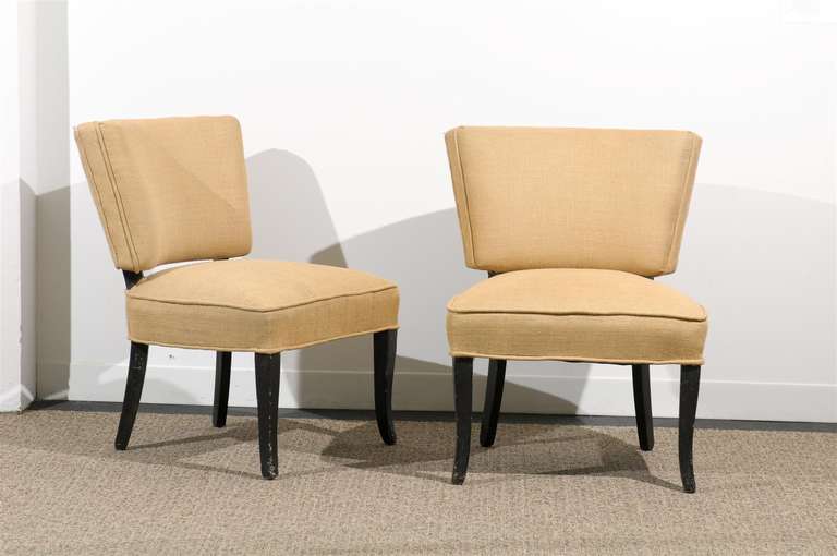 Pair of Vintage Slipper Chairs upholstered in Natural Burlap. Wood Legs With Ebony Patina. Circa 1950