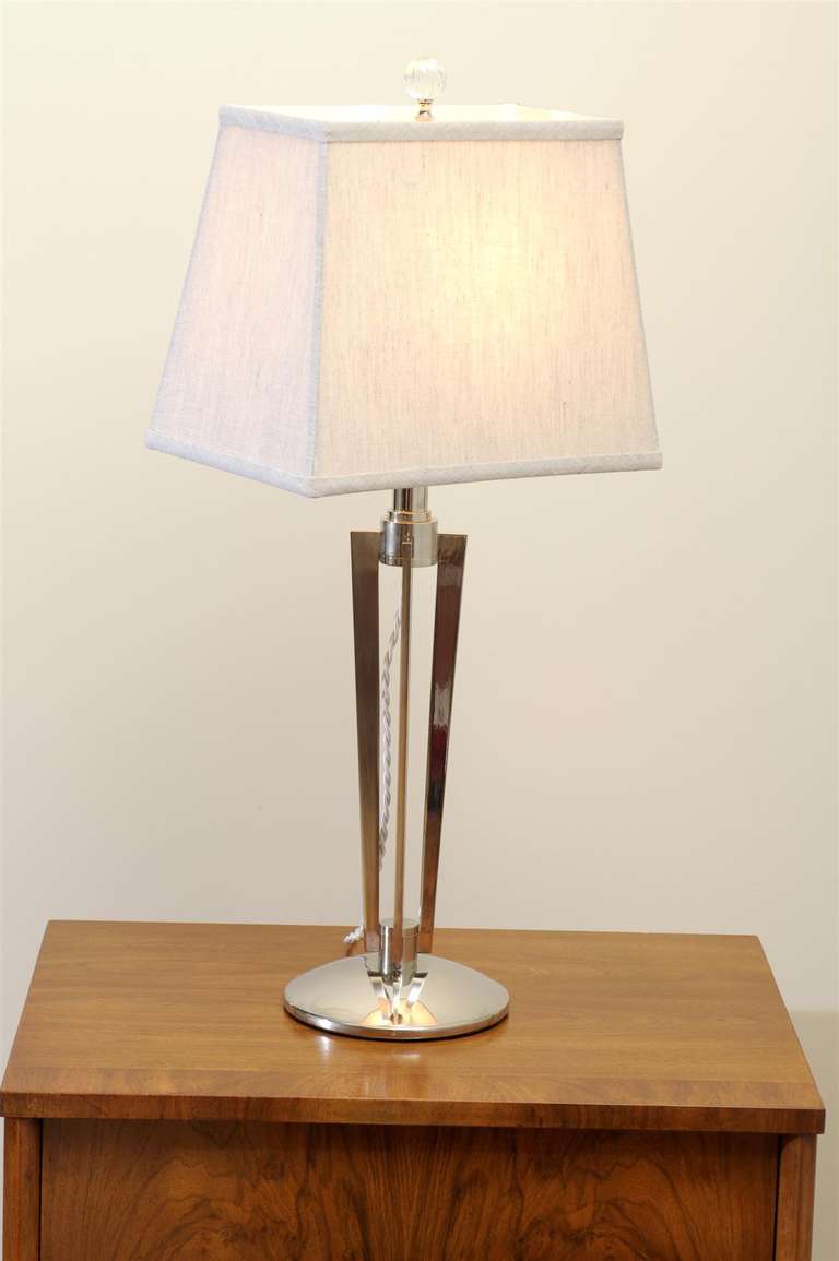 A Stellar pair of sculptural modern lamps in nickel, circa 1960's. Substantial, well made pieces with Beautifully Executed detail. Exquisite Jewelry ! Excellent Restored Condition. The lamps have been re-plated, rewired with braided silk cord,