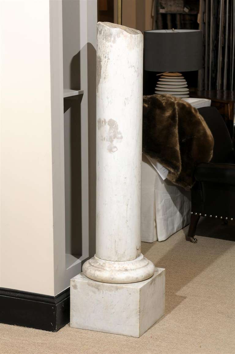 White or grey antique marble column.