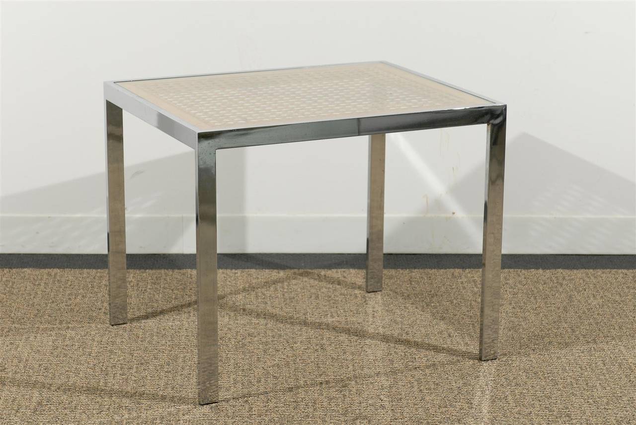Extremely sophisticated pair of midcentury side tables. Unusually large size caning under inserted glass tops on chrome bases.
Stunning!