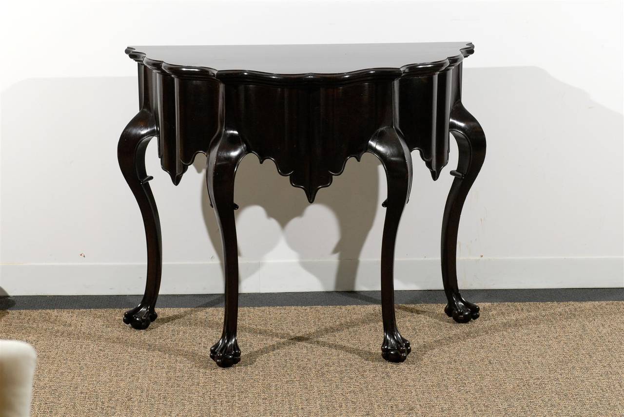 Very Chic Chippendale Style Console With Portuguese Influence. Fluid Top & Console Apron Raised on Graceful Cabriole Legs ending with Ball & Claw feet.
Gently Polished & Restored Brown / Ebony Patina.