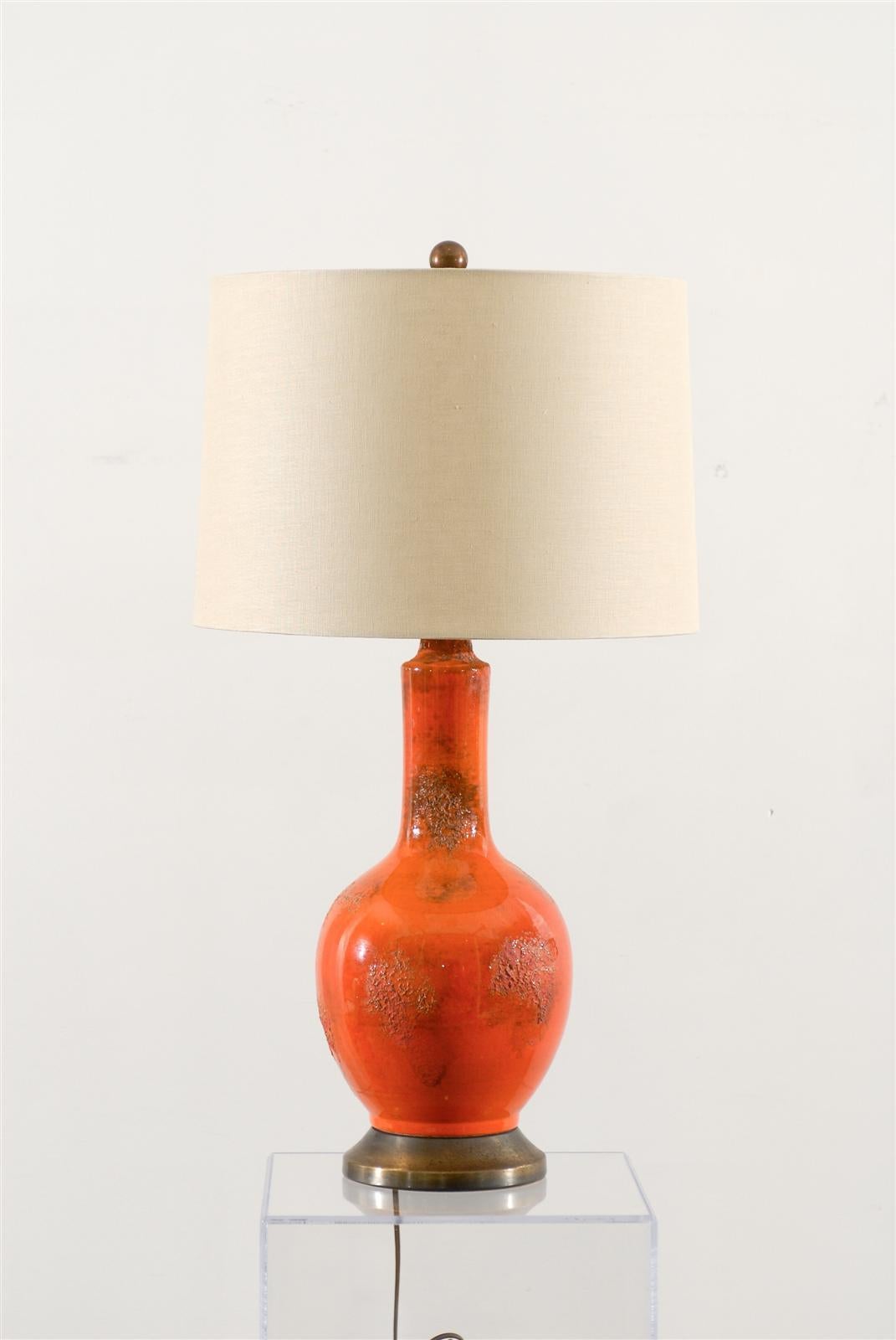 Beautiful pair of Mid-Century Modern lamps in striking orange textured glaze on antique brass bases with new linen drum shades, simple ball finials. Texture and shade color are great together.

28.5