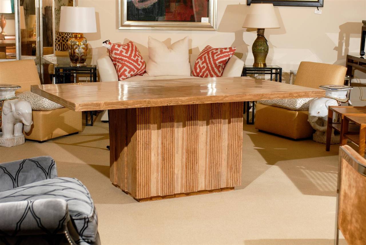 Midcentury style dining table with stone top. Base is combination wood and stone. 
Top measures 72