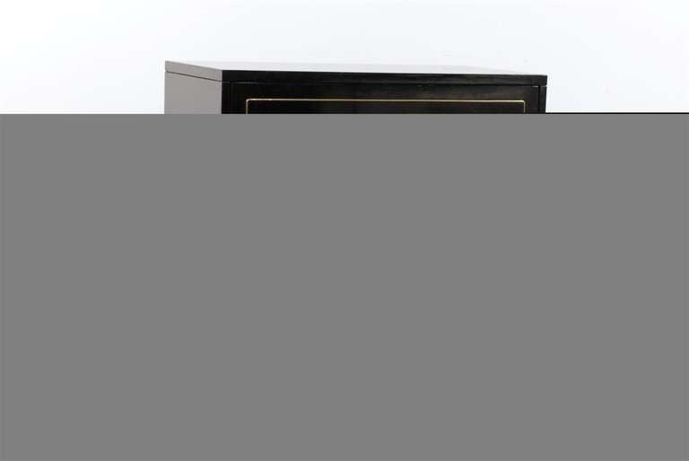 Beautiful black lacquered three-drawer midcentury style chest.
Chic brass pulls.