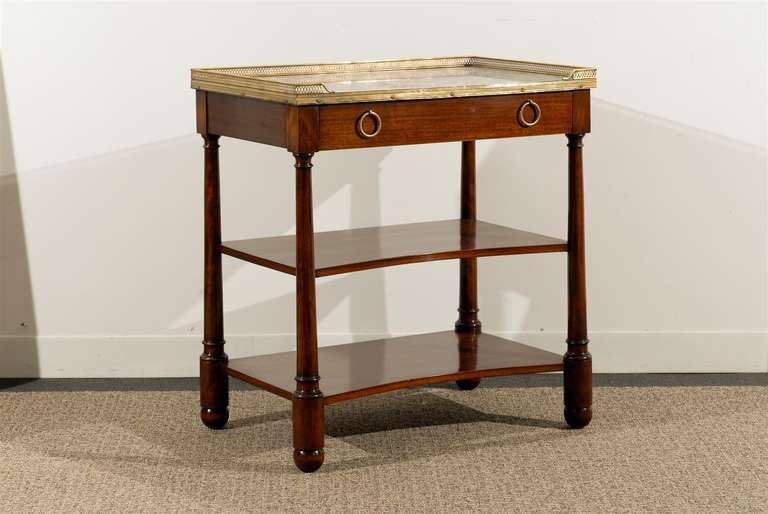 Empire style marble top table with brass gallery , single drawer and two shelves in mahogany.