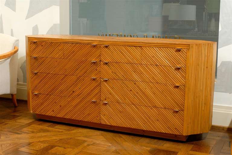 This magnificent commode is shipped as professionally photographed and described in the listing narrative: Meticulously professionally restored and completely installation ready.

An exceptional bamboo ten drawer commode, circa 1970. Beautiful case