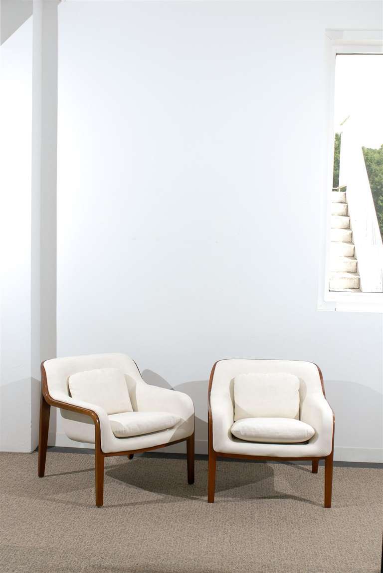 A fabulous pair of Bill Stephens for knoll lounge/club chairs, circa 1975. A beautifully conceived design; extremely comfortable and expertly crafted. Excellent restored condition. The walnut frames have been professionally cleaned and re-lacquered.