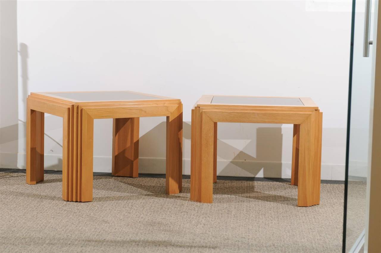 Chic pair of Mid-Century Modern side tables in beautiful blond colored beech or walnut, with inserted smoked glass tops.
Measure: 28