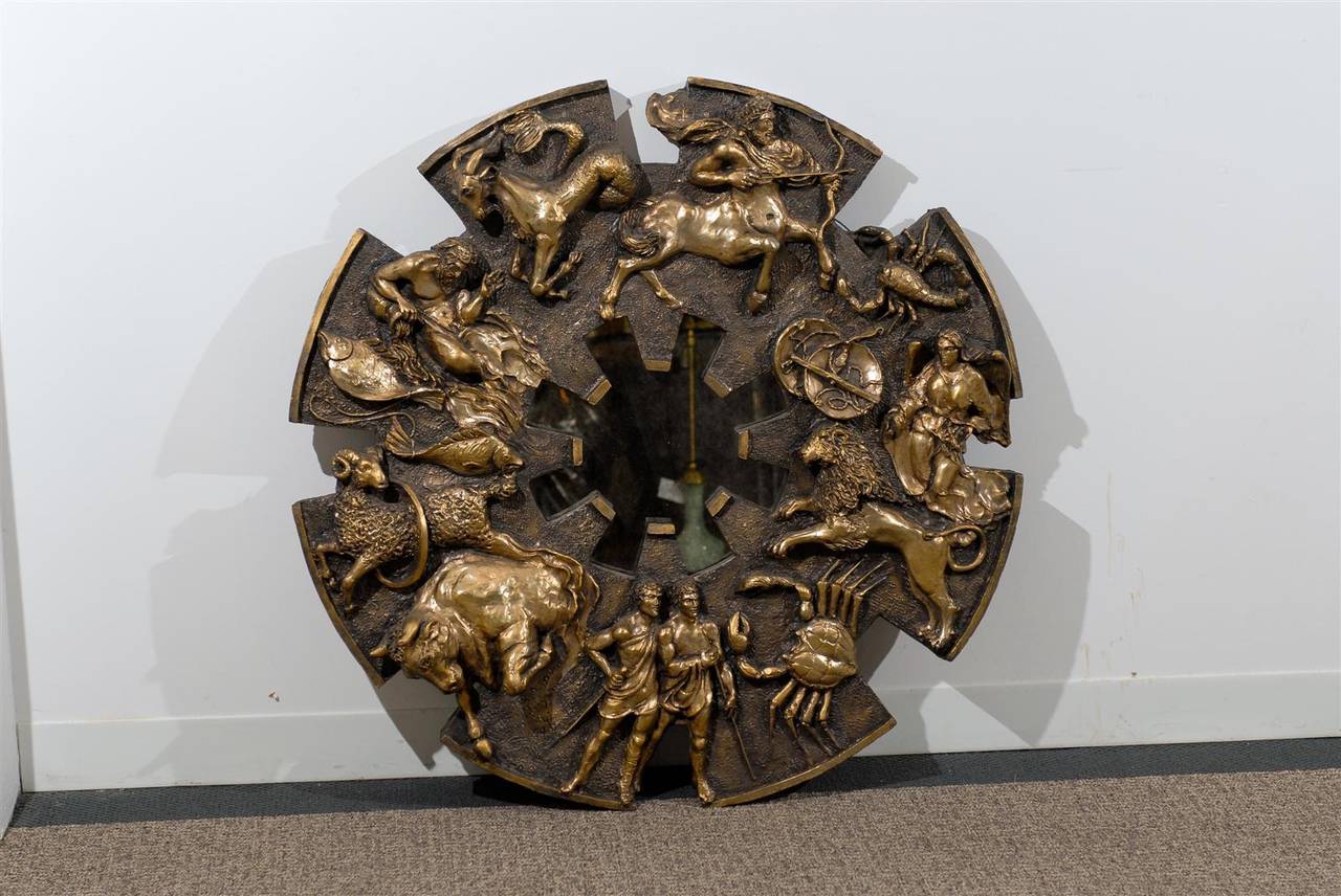 A Wonderful Brutalist style Zodiac mirror by Finesse Originals, circa 1970's.  Cast resin with a custom bronze finish.  Fabulous texture and detail, this particular mirror portrays the authentic look of metal.
