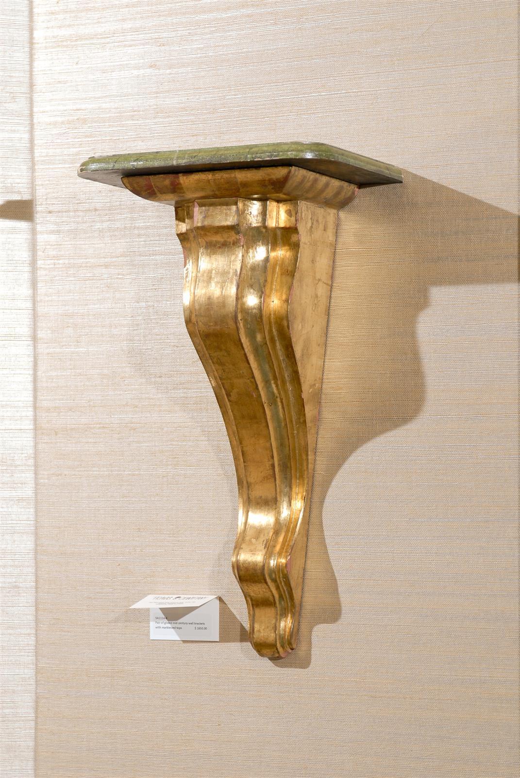 Pair of Mid-Century style water gilded brackets with marbleized shelf in green tones.