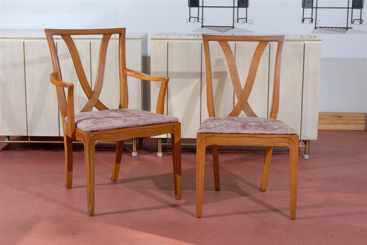 These magnificent dining chair frames are shipped meticulously restored in customer choice of lacquer. Expert custom upholstery service is available.

A stunning set of eight ( 8 ) maple dining chairs by Tomlinson, circa 1955.  There are two ( 2 )