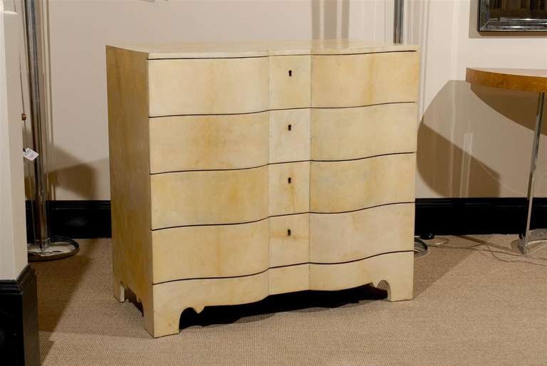 A modern interpretation of a classical Georgian form in the style of the American architect and furniture designer Samuel Marx (1885-1964). Vellum parchment over hardwood, with marbleized paper lining the drawers and covering the chest back. Case