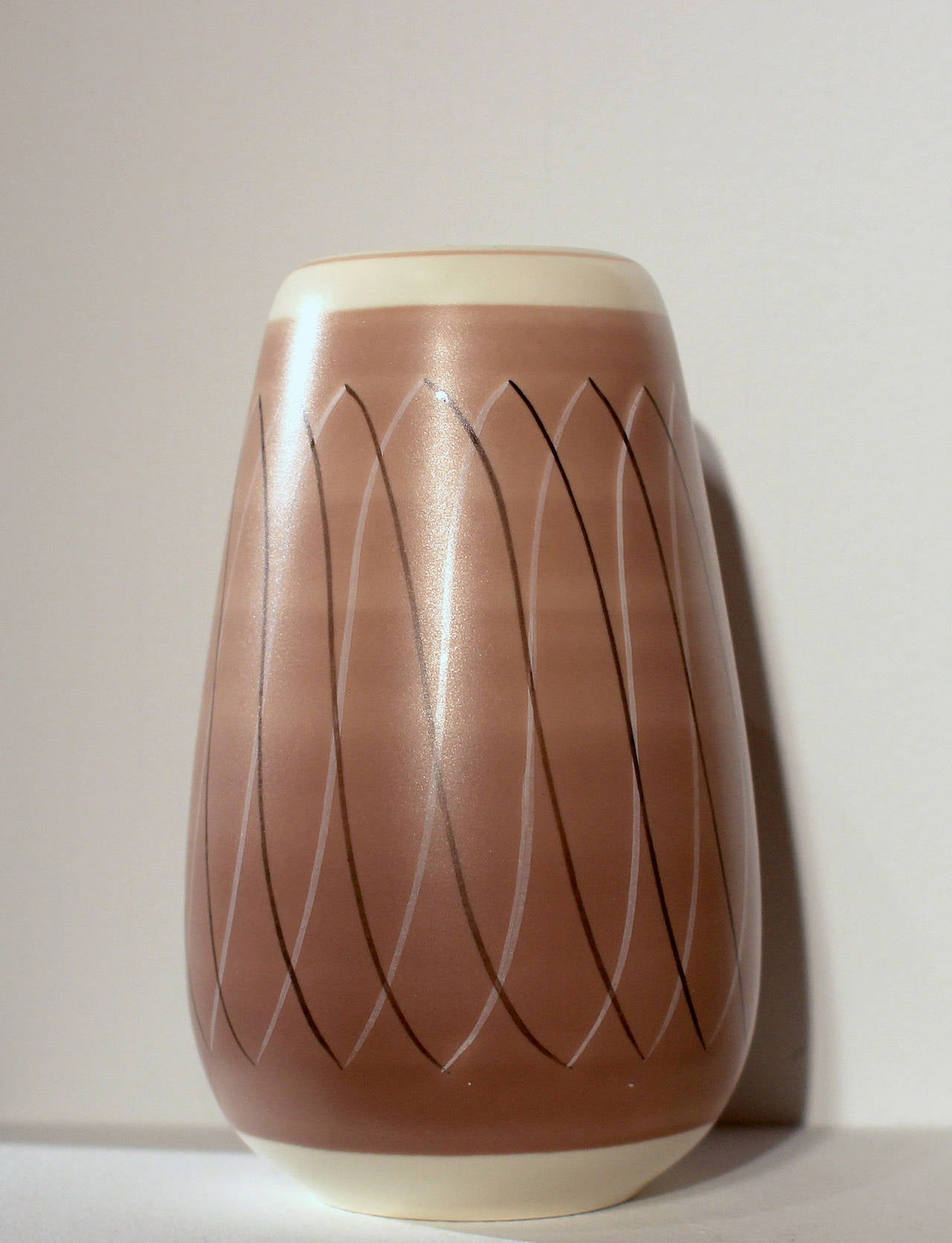 1950s free-form Poole Pottery in modernist painted designs.

Starting out as a tile manufacturer in the 19th century, the Poole company developed outstanding glazing techniques and interesting forms. In the 1950s, after the wartime restrictions