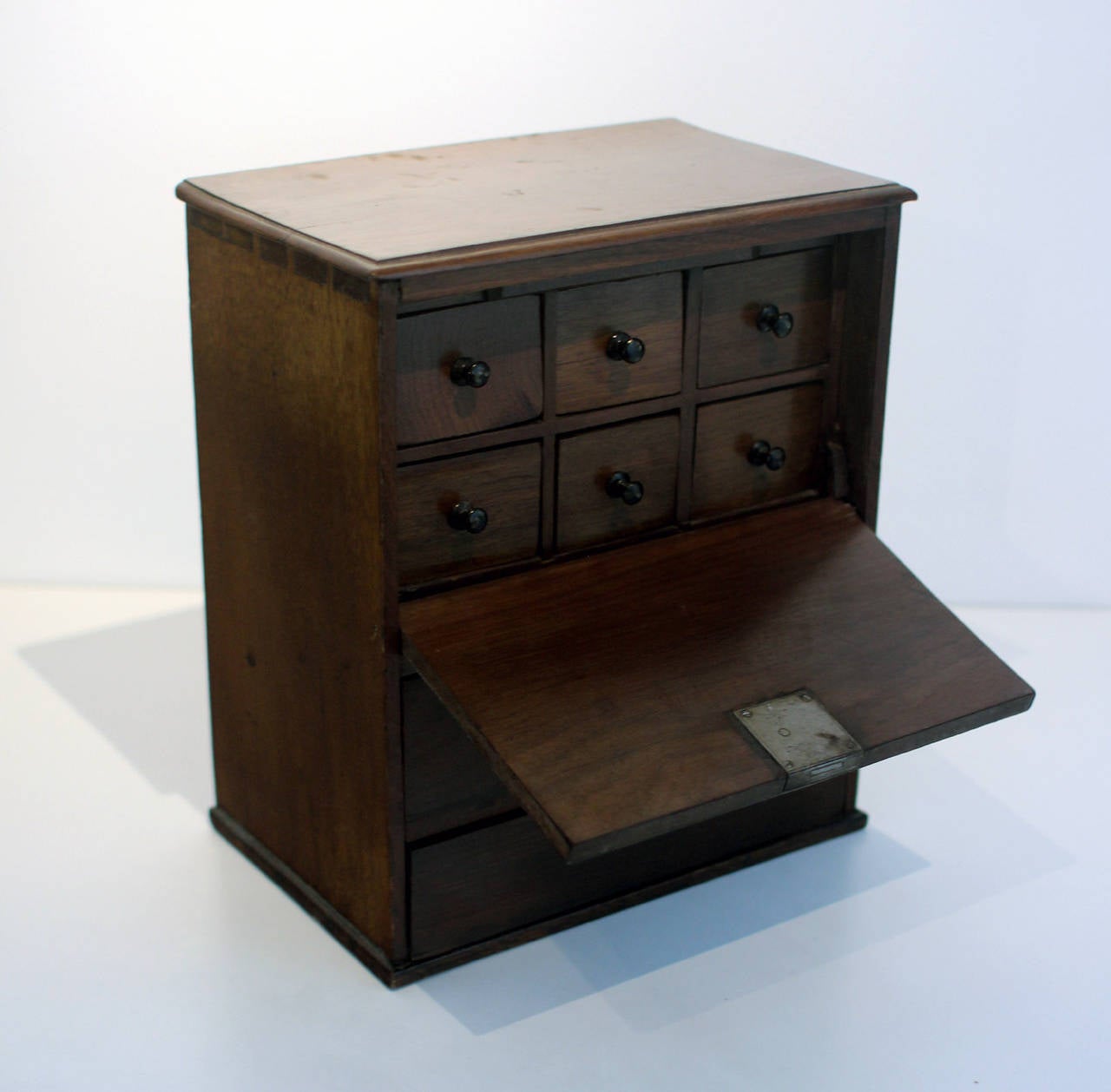 Handsome walnut, dovetailed box with drop lid and drawers, made for use by a doctor for medicines, etc, with original locks and key. The drawers are each dovetailed, too, American, early 19th century. Rich color to the wood, drawer knobs retain