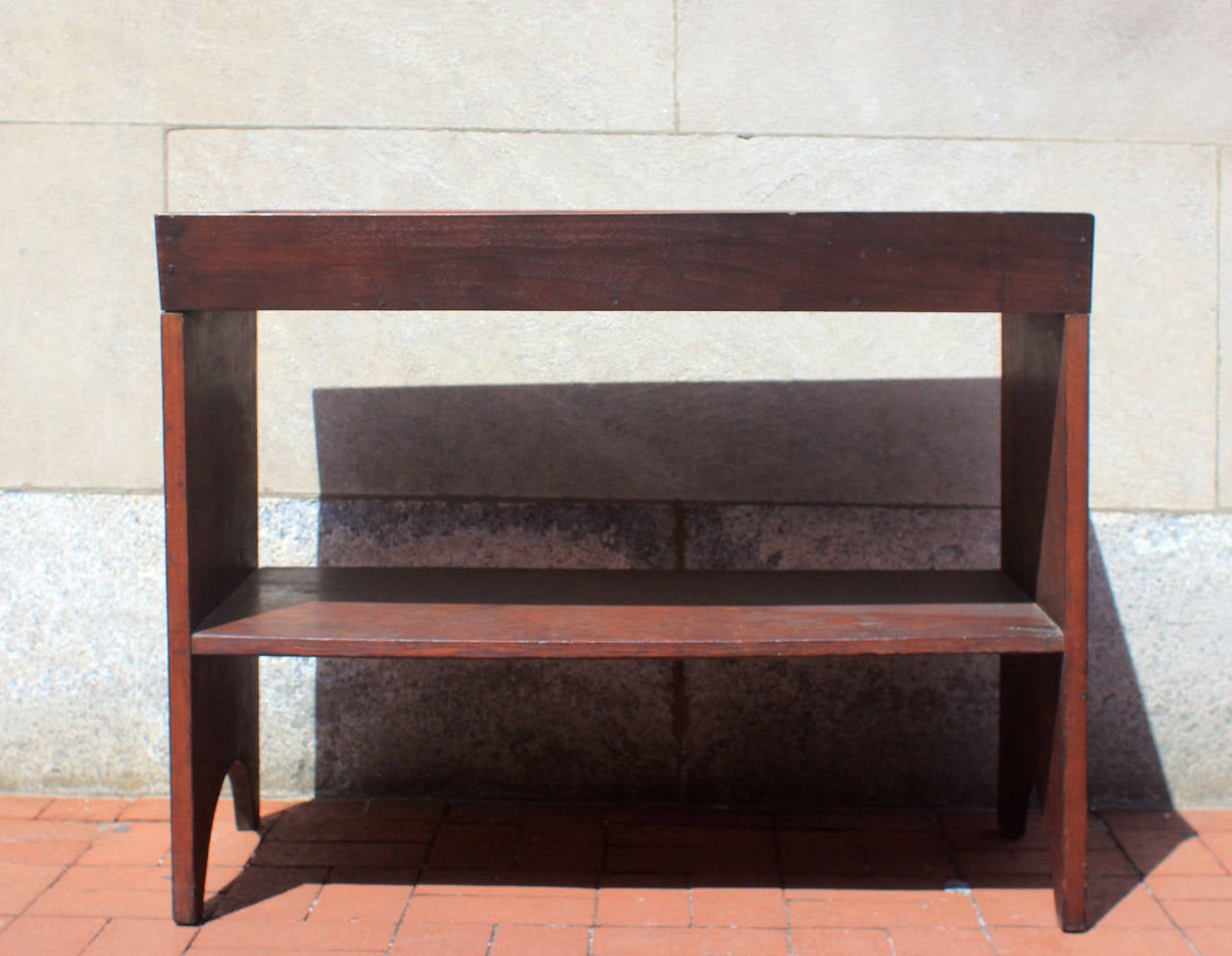 Very well-constructed and unusual walnut bucket bench would make an excellent, small dry sink. Mortise and tenon construction with canted sides, nice form, American, circa 1850. Very good patina and finish.