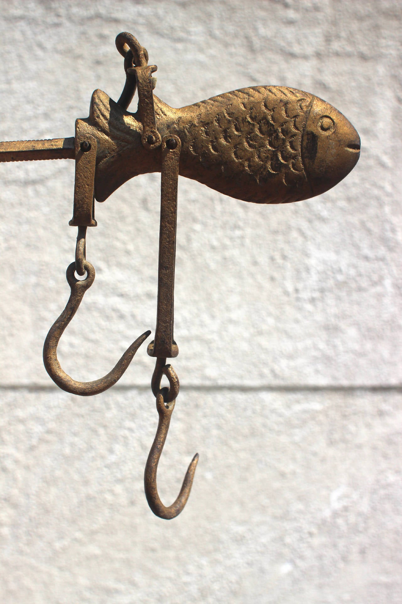 Wonderfully folky iron fish stilliard portable scale in original gold paint - must have been used to weigh fish. Has all of its original hooks and parts.