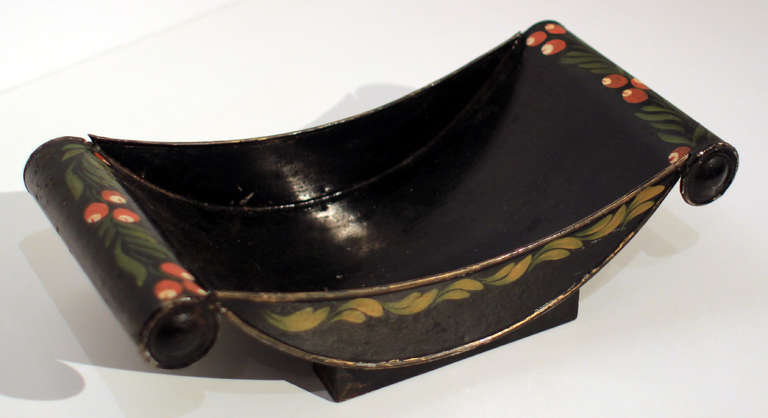 Cheese wheel holder in nice tole paint decoration on black, all original. English, mid-19th century.