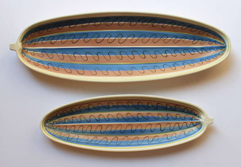 1950s free-form Poole Pottery in modernist painted designs.

Starting out as a tile manufacturer in the 19th century, the Poole company developed outstanding glazing techniques and interesting forms. In the 1950s, after the wartime restrictions