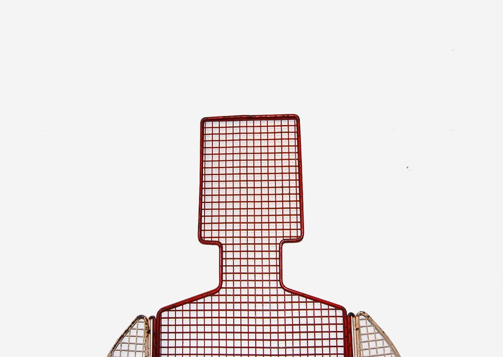 Highly graphic and whimsical mesh wire store mannequin with original red and white paint. Arms swivel and are removable from torso, as well as the legs. Missing a stand, but has been hung on a wall. Mid 20th century American.