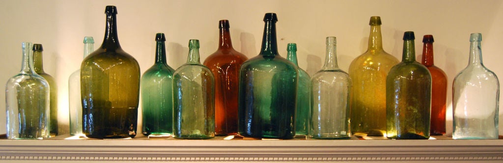 19th Century Collection of 14 Large American Glass Demijohn Bottles