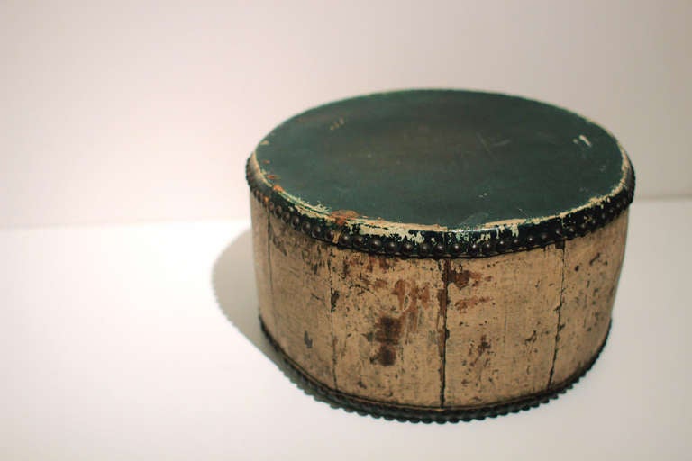 Folky camp drum from New York State, circa 1890, painted leather and wood with brass tacks, excellent original finish throughout. Meant to make noise by shaking - drumming device is inside - or beating. Construction is like that of a barrel.