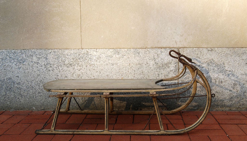 Wonderful American folk art child's sled with highly unusual wrought iron throughout - swan necks and heads with original paint detail - whitewash paint to the wood; late 19th century.