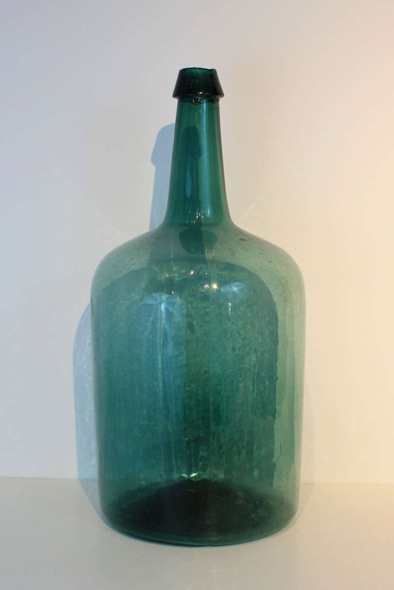 Teal green glass bottle, hand blown and molded, excellent deep color; American, 3rd quarter 19th century.
